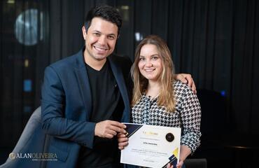 Dental surgeon Julia with certificate